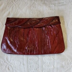Rich red burgundy Eel skin clutch
